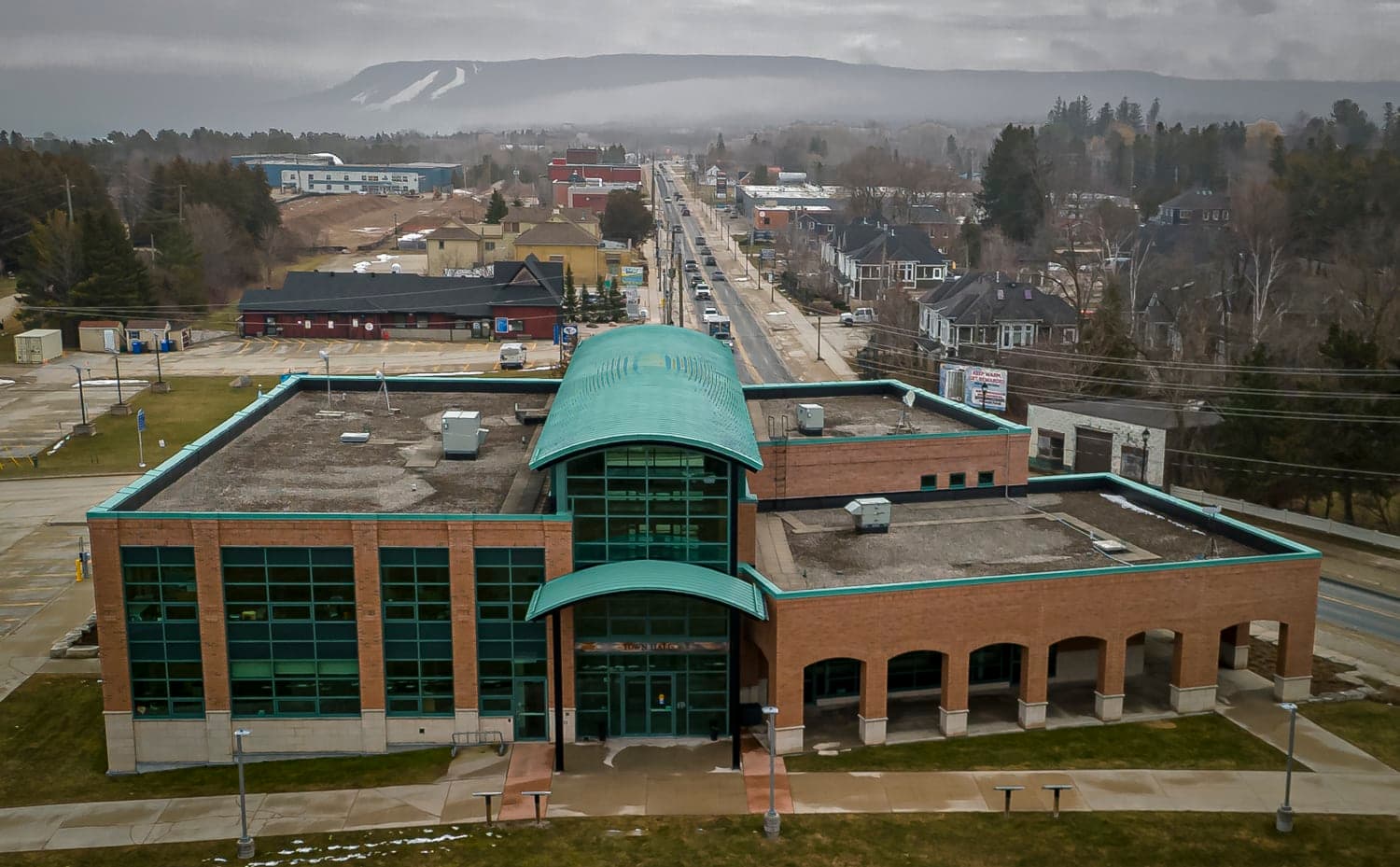 Town hall building with the ski hills in the background
