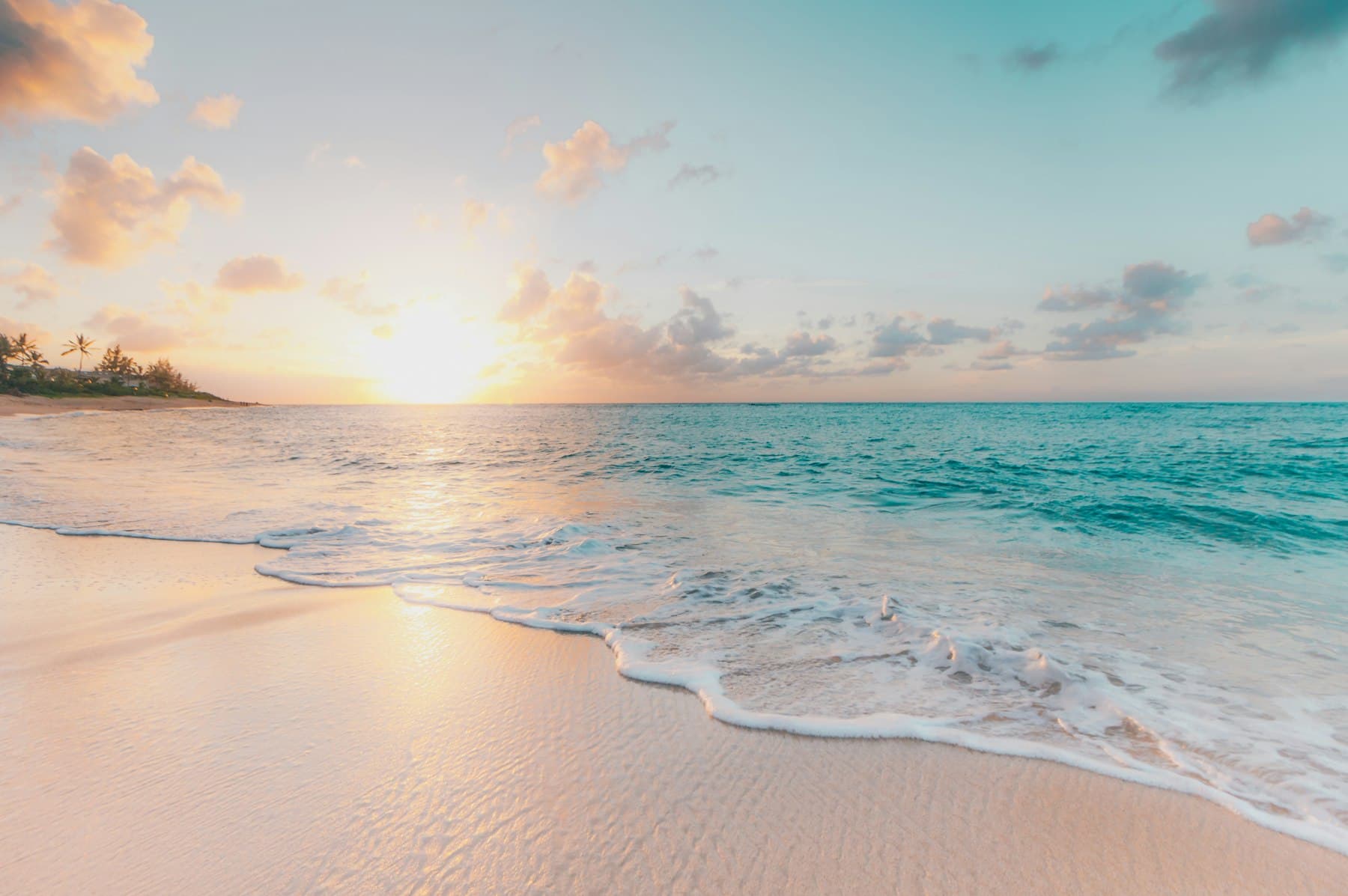 Sand and shallow water meeting at the beach