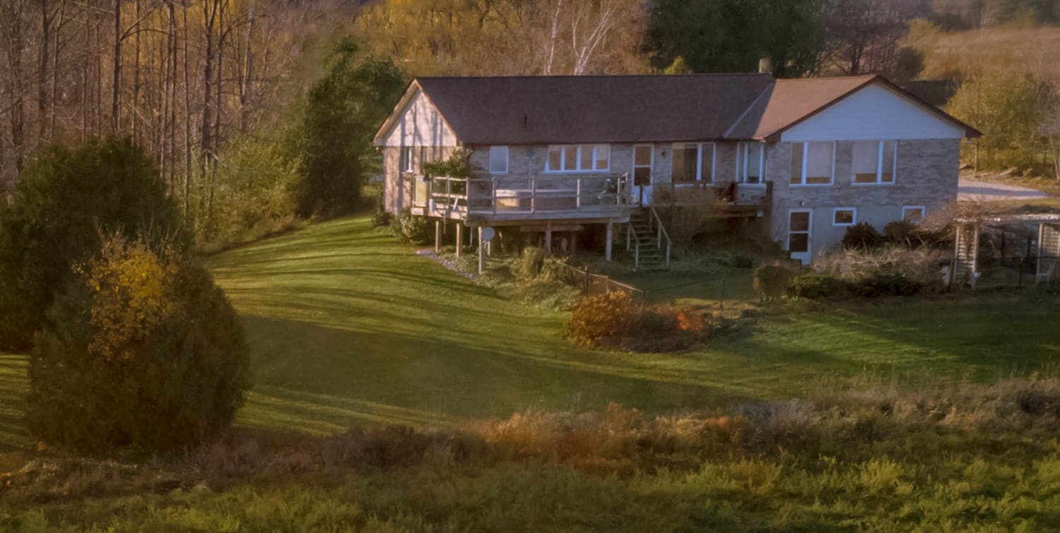 Home exterior lit by warm evening light