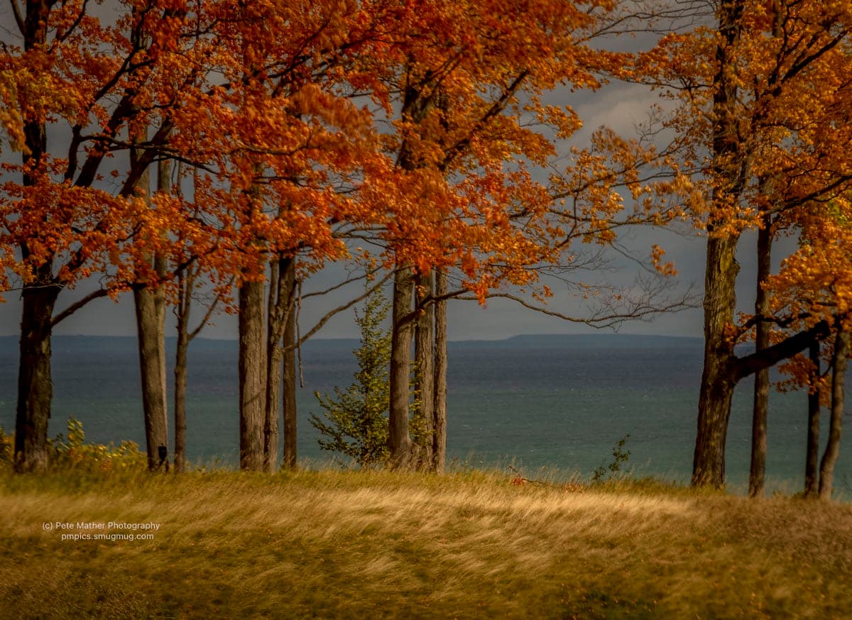 Autumn maples framing the bay with the escarpment on the far shore